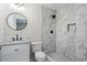 Beautiful bathroom featuring a tiled shower, vanity with sink, and modern fixtures at 2478 Graywall St, East Point, GA 30344