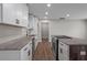 Modern kitchen with granite counters, stainless steel appliances, and grey accent walls at 2478 Graywall St, East Point, GA 30344