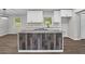 Open-concept kitchen featuring a center island with wood paneling and stainless steel appliances at 2478 Graywall St, East Point, GA 30344
