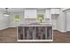 Kitchen island with wood accents, granite countertops, and modern appliances at 2478 Graywall St, East Point, GA 30344