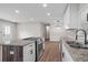 Modern kitchen with stainless steel appliances, granite countertops, and white cabinets offers a stylish space at 2478 Graywall St, East Point, GA 30344