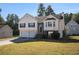 Traditional two-story home with a neat front lawn, showcasing curb appeal and a welcoming entrance at 2733 Cedar Tree Ln, Ellenwood, GA 30294