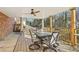 Covered back deck area with a dining table and a ceiling fan at 767 Smithstone Se Rd, Marietta, GA 30067