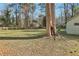 Large backyard with mature trees providing ample shade and greenery at 767 Smithstone Se Rd, Marietta, GA 30067