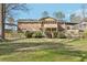 Large backyard featuring an expansive multi-level deck, landscaping, and inviting outdoor space at 767 Smithstone Se Rd, Marietta, GA 30067