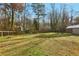 Wide open backyard with a shed and newly installed wooden fence at 767 Smithstone Se Rd, Marietta, GA 30067