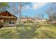 Expansive backyard featuring a shed with covered area and lush green grass at 767 Smithstone Se Rd, Marietta, GA 30067