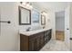 Bright bathroom featuring a double vanity with marble countertop and classic fixtures at 767 Smithstone Se Rd, Marietta, GA 30067