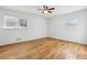 Bright bedroom features hardwood floors, white walls, two bright windows, and a ceiling fan at 767 Smithstone Se Rd, Marietta, GA 30067