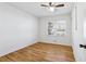 Cozy bedroom features natural light from a bright window and hardwood flooring throughout the room at 767 Smithstone Se Rd, Marietta, GA 30067