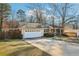 A charming brick home with an attached garage and mature trees at 767 Smithstone Se Rd, Marietta, GA 30067