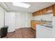 Basement kitchenette with full-size refrigerator, cabinets, and countertop at 767 Smithstone Se Rd, Marietta, GA 30067