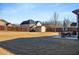 Wide backyard with a well-kept lawn, a shed, and a patio set for outdoor enjoyment at 821 Bufflehead Ct, Stockbridge, GA 30281