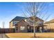 Exterior view of the home showing the backyard, lawn, and covered patio at 821 Bufflehead Ct, Stockbridge, GA 30281