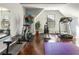 Well-lit home gym with hardwood floors and modern exercise equipment at 821 Bufflehead Ct, Stockbridge, GA 30281