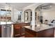 Open kitchen featuring granite counters, stainless steel appliances, and seamlessly flowing into the living room at 821 Bufflehead Ct, Stockbridge, GA 30281