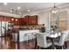 Kitchen and dining area featuring a marble countertop island and stainless steel appliances at 821 Bufflehead Ct, Stockbridge, GA 30281