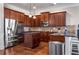 Elegant kitchen featuring dark wood cabinetry and stainless steel appliances at 821 Bufflehead Ct, Stockbridge, GA 30281