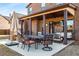 Outdoor patio with dining table, seating area, and ceiling fans for relaxing or entertaining at 821 Bufflehead Ct, Stockbridge, GA 30281