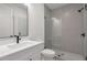 Modern bathroom featuring frameless glass shower, white vanity, and matte black fixtures at , Dunwoody, GA 30338