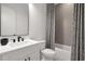 Modern bathroom with a sleek vanity, white tile, and contemporary fixtures at , Dunwoody, GA 30338