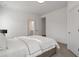 Neutral bedroom with neutral carpet and wall paint, with an adjacent bathroom visible through a door at , Dunwoody, GA 30338