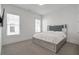 Bright bedroom featuring neutral carpet, large windows, and a mirrored bed frame with built-in storage drawers at , Dunwoody, GA 30338