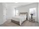 Bright bedroom featuring a modern bed frame with integrated lighting and neutral decor at , Dunwoody, GA 30338