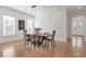 Dining room with modern light fixture, decorative accent wall, hardwood floors, and lots of natural light at , Dunwoody, GA 30338