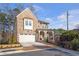 Beautiful brick home with a two-car garage and a cozy front porch at , Dunwoody, GA 30338