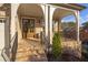 Inviting front porch with brick steps, iron railings, and a stylish entryway at , Dunwoody, GA 30338