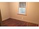 Inviting bedroom with hardwood floors, a bright window, and a warm, neutral color scheme at 1840 Madrona Nw St, Atlanta, GA 30318