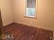 Bedroom with hardwood floors; fair natural light from window at 1840 Madrona Nw St, Atlanta, GA 30318