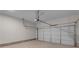 Spacious garage with a clean concrete floor and a white garage door at 1848 Laurel Green Way, Atlanta, GA 30344