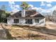View of the back of the home with a window-lined wall at 2577 Twin Oaks Sw Dr, Marietta, GA 30064