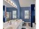 Bathroom with a double sink vanity and private toilet at 2577 Twin Oaks Sw Dr, Marietta, GA 30064