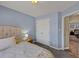 This bedroom features a closet and space for bedside tables for convenience at 2577 Twin Oaks Sw Dr, Marietta, GA 30064