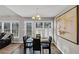 Cozy dining area featuring modern table, chairs, and natural light from large windows at 2577 Twin Oaks Sw Dr, Marietta, GA 30064