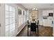 Cozy dining area featuring modern table, chairs, and natural light from large windows at 2577 Twin Oaks Sw Dr, Marietta, GA 30064