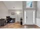 Inviting entryway with wood floors and a view of a home office with a large window at 2577 Twin Oaks Sw Dr, Marietta, GA 30064