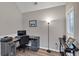 Comfortable home office with neutral walls, desk, computer, and a large window at 2577 Twin Oaks Sw Dr, Marietta, GA 30064
