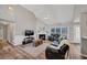 Bright living room with a vaulted ceiling, a fireplace, and wood flooring at 2577 Twin Oaks Sw Dr, Marietta, GA 30064