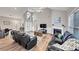 Spacious living room with fireplace, vaulted ceilings, modern floors, and comfortable seating at 2577 Twin Oaks Sw Dr, Marietta, GA 30064