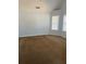 Bedroom with carpet flooring, vaulted ceiling, and a window that lets in natural light at 1546 Mine Run, Hampton, GA 30228