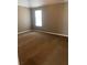 Neutral bedroom with a window providing natural light and wall-to-wall carpet at 1546 Mine Run, Hampton, GA 30228