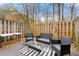 A fenced in backyard featuring a patio set on a striped outdoor rug at 204 Summer Pl, Norcross, GA 30071