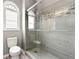 Modern bathroom featuring gray subway tile in the walk-in shower and a toilet at 204 Summer Pl, Norcross, GA 30071