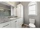 Bathroom featuring granite counters, white cabinets, and a walk-in shower at 204 Summer Pl, Norcross, GA 30071