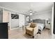 Bedroom with an accent chair and a bed with a tufted headboard at 204 Summer Pl, Norcross, GA 30071