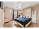 Bedroom with hardwood floors, a ceiling fan, and a queen bed at 204 Summer Pl, Norcross, GA 30071